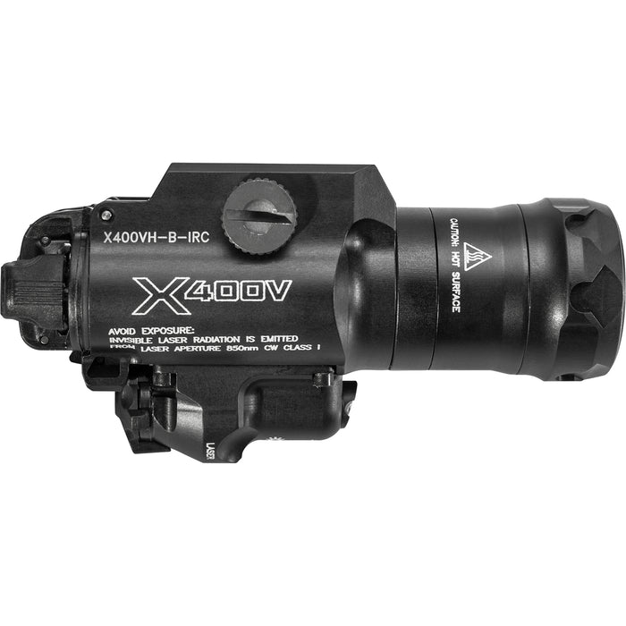 A right-side profile photograph of the SureFire X400VH Vampire, clearly displaying the laser warning labels and the dual-spectrum head assembly designed for rugged tactical use.