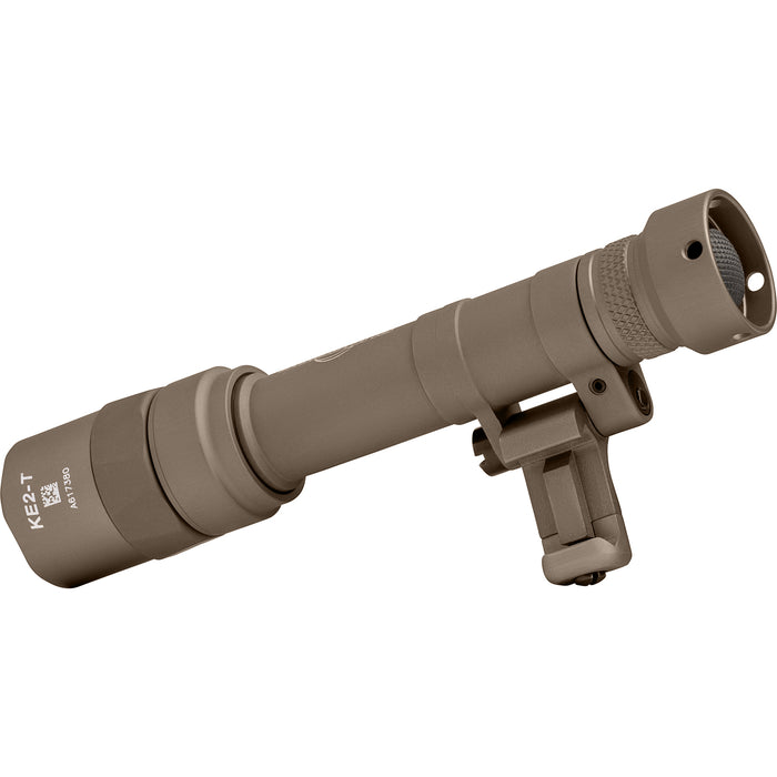 A rear isometric view from the right of the tan SureFire M640T Long-Gun WeaponLight, highlighting the tailcap switch and the integrated hinge mount for precise positioning.