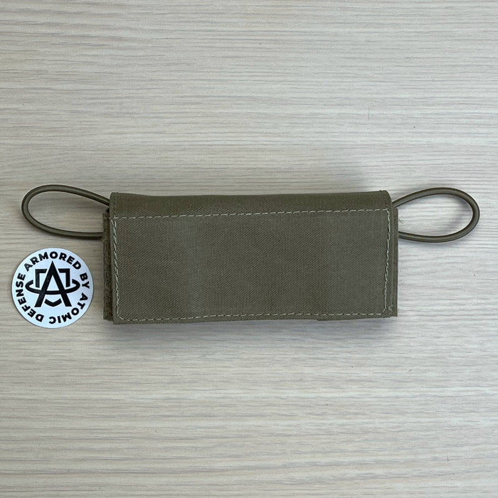 A high-resolution photo of the Ranger Green team wendy exfil counterweight kit in size large, showing the three 0.5 lb weights and the heavy-duty nylon pouch designed to balance 1.5 lbs of headborne gear.