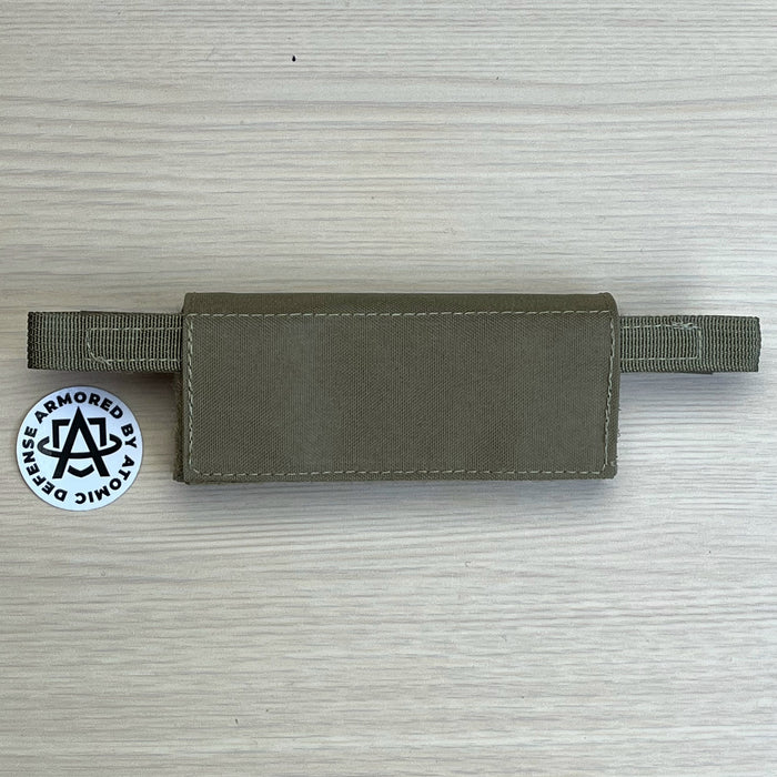 A high-resolution photo of the Ranger Green team wendy exfil counterweight kit in size small, showing the three 0.25 lb weights and the durable fabric pouch used to balance lighter headborne setups.