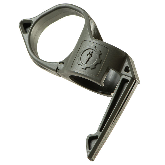 An image of the Thyrm Switchback 2.0 pocket clip in the color sage green, with the item itself positioned in the center and tilted to the left; the item's logo is branded in the center, the clip's ringer ring is on the right, and the accessory's pocket clip feature is on the left, the longer portion of the item.