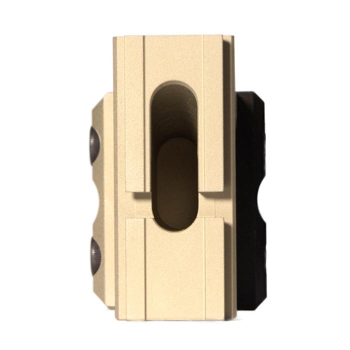 A top-down, bird's-eye view of the flat dark earth Dynamic Optronic Technologies Delta ACRO Mount, detailing the specific optic mounting footprint and the overall width of its clamping base.