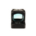 an image showing the back view of the red dot sight item against a pure white background and showcases the window of the sight and a a crisp, perfectly centered, red aiming reticle, depicted as a fine circle with crosshairs and a central 1 MOA dot.