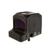 a right backside isometric product photo of the Trijicon RCR Red Dot Sight against a plain white background and prominently featured at the front-left, reflecting a dramatic green and orange dichroic coating and showing small white laser-engraved markings are visible along the base on the side saying '000030', 'RC01', and 'ISA 58:8'. At the base-front, another adjustment dial and 'UP' text with directional arrows are visible, and a short portion of a black mounting screw extends from the rear. 
