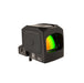 an rightside isometric product photo of the Trijicon RCR Red Dot Sight against a plain white background and prominently featured at the front-left, reflecting a dramatic green and orange dichroic coating and showing small white laser-engraved markings are visible along the base on the side saying '000030', 'RC01', and 'ISA 58:8'

