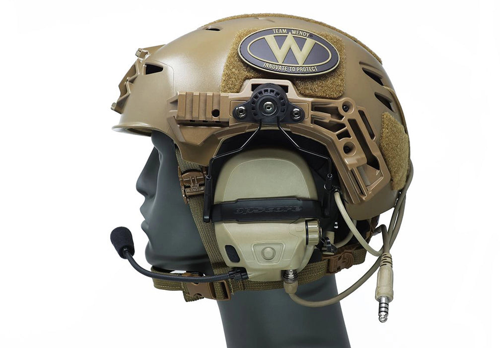 A side profile view showing the black unity mark 2 securely mounting a single-lead ranger green Ops-Core AMP headset to the accessory rails of a coyote brown Team Wendy EXFIL bump helmet, providing a reliable and low-profile attachment solution.