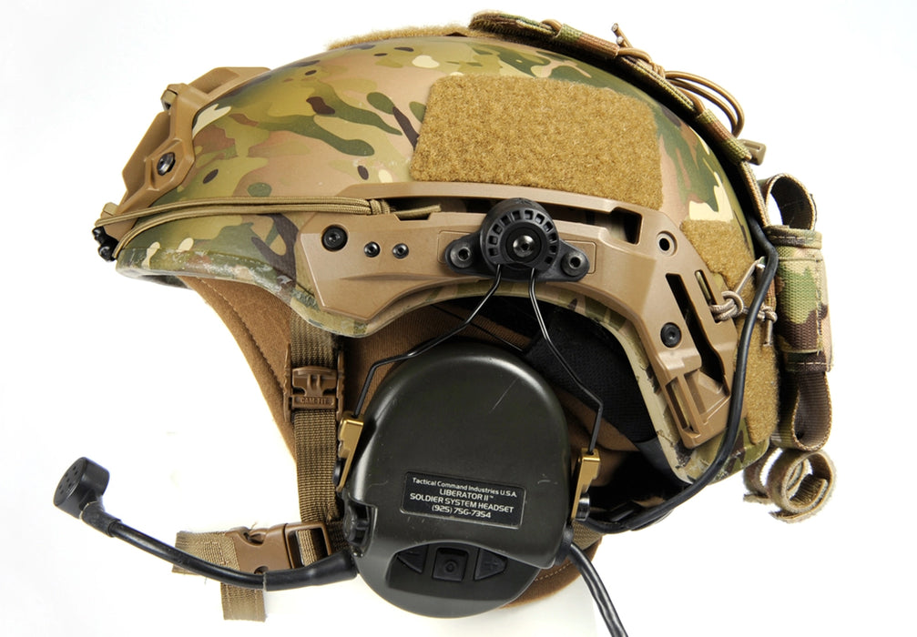 A close-up view of the black unity mark system mounted on a Multicam Team Wendy EXFIL ballistic helmet, showing the secure connection to a Liberator II headset to provide a low-profile, high-performance ear cup seal.