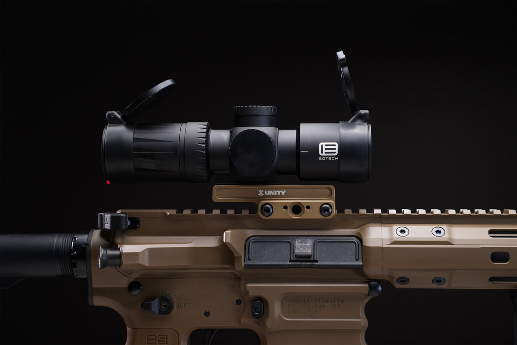 A side profile view of the Unity Tactical FAST Kickr mount in Flat Dark Earth installed on a Cobalt Kinetics AR-15, displaying the mount's lightweight interface and 1.54-inch heads-up positioning capabilities.
