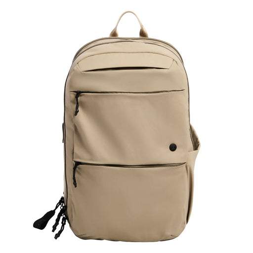 A frontal view of the Outpost Tan Vertx Any Day Backpack, showing its professional, low-profile design with two large external zipper pockets and a durable water-resistant finish.