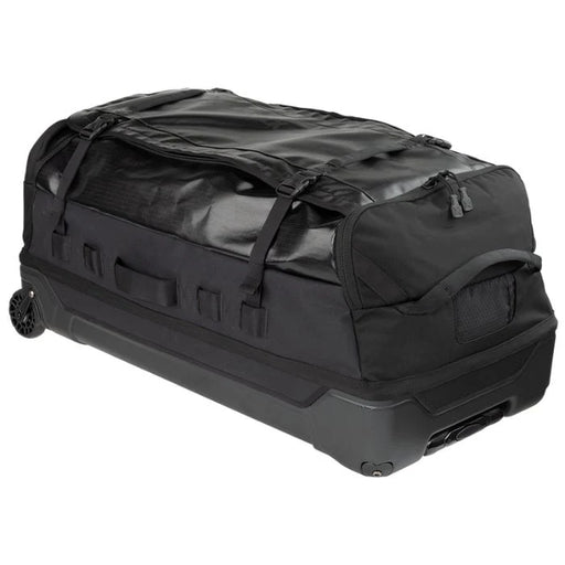 A side angled view shows the Vertx RLT 100L Roller Duffel Bag highlighting its sturdy aluminum retracting handle and the translucent mono-honey mesh ID slot positioned clearly in the foreground.