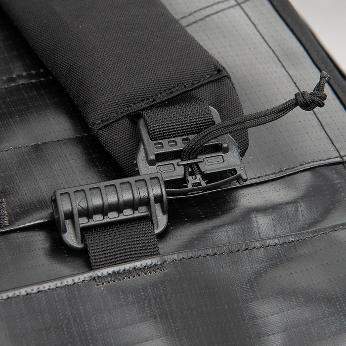 This close-up highlights the heavy-duty quick-release buckles on the Vertx RLT 80L Duffel Backpack, showing the rugged hardware that enables users to switch between backpack and handheld carry modes in seconds.