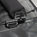 This close-up highlights the heavy-duty quick-release buckles on the Vertx RLT 80L Duffel Backpack, showing the rugged hardware that enables users to switch between backpack and handheld carry modes in seconds.