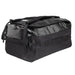 This right-angled side view of the black Vertx RLT 80L Duffel showcases the rugged water-resistant shell, the subtle brand logo, and the large expandable side pouch in the foreground that offers extra storage for quick-access items.