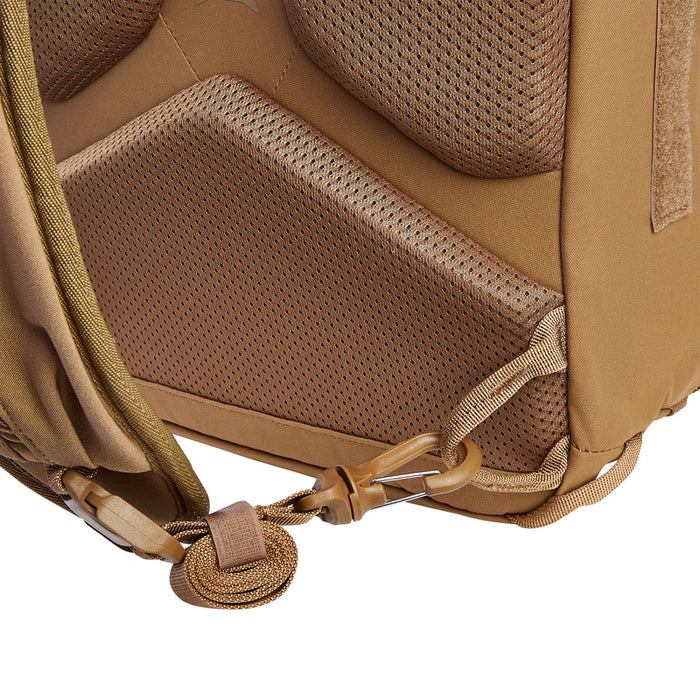 Rear view of the Vertx Siege 15L Tactical Sling in Coyote Brown, featuring the breathable rear mesh and expandable strap in the foreground.