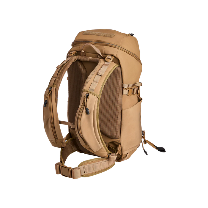 Rear angled view of the Vertx Siege 35L Backpack, featuring the padded shoulder straps in the foreground designed for comfort and stability during heavy loadout transport.