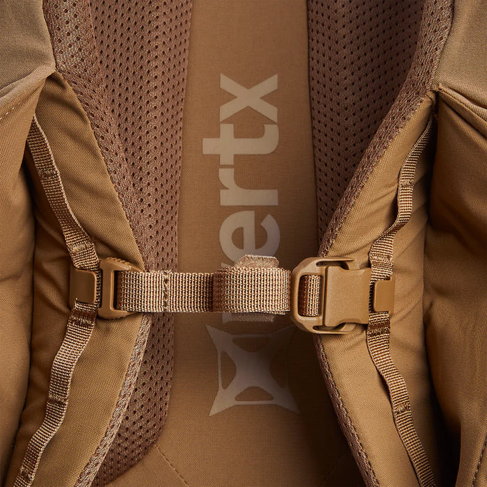 Close-up view of the adjustable sternum strap on the Vertx Siege 35L Military Backpack, designed for extra comfort and load stability, with breathable mesh visible in the background.