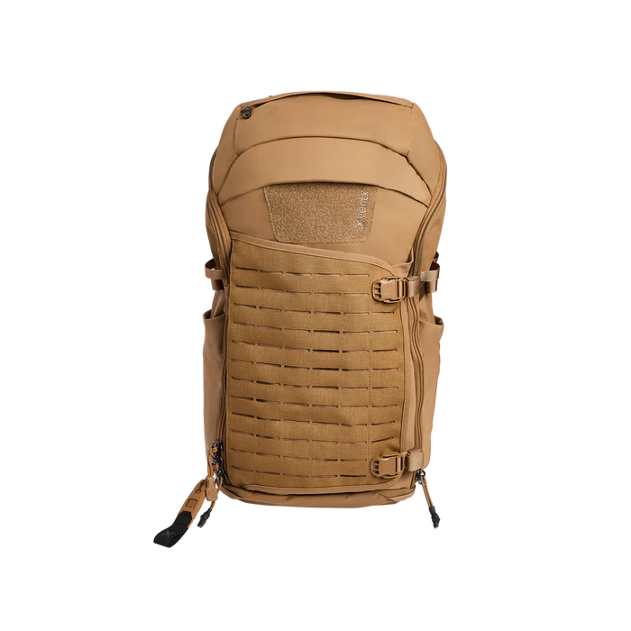 Frontal view of the Vertx Siege 35L Pack in Coyote Brown, prominently displaying the laser-cut 500D MOLLE panel on the expandable front pocket.
