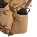 Close-up of the side pocket on the Vertx Siege 35L Pack demonstrating its expanding capability to securely hold large water bottles or tactical gear.