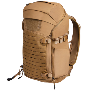 Side-angled view of the Vertx Siege 35L Tactical Backpack in Coyote, displaying its rugged profile and accessible side pockets.