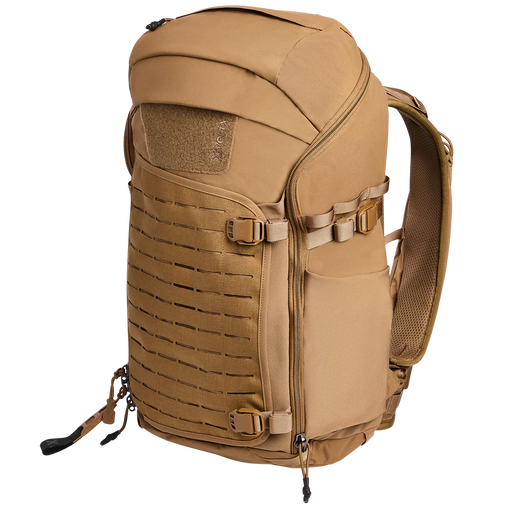 Side-angled view of the Vertx Siege 35L Tactical Backpack in Coyote, displaying its rugged profile and accessible side pockets.