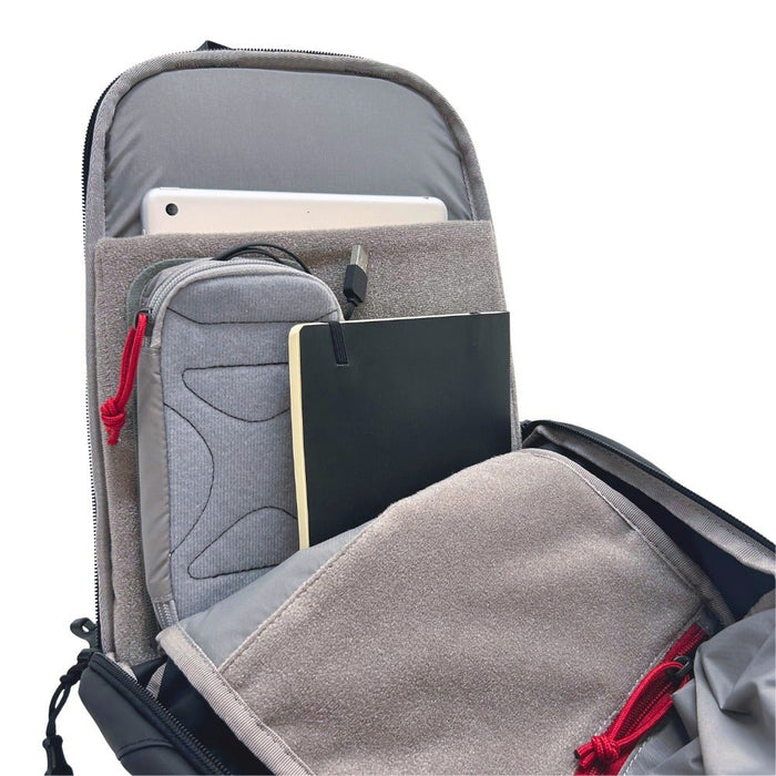 vertx urban ghost sling bag interior laptop and tablet sleeves angled