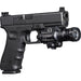 A detailed view of the X400VH Weaponlight SureFire mounted securely to the accessory rail of a handgun, showing the ambidextrous toggle switches and the laser housing positioned underneath the main bezel.