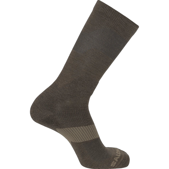 A side profile view of the XA Forces Crew Socks in Coyote Brown, highlighting the reinforced heel and toe areas for durability, along with the breathable mesh panels for moisture management.