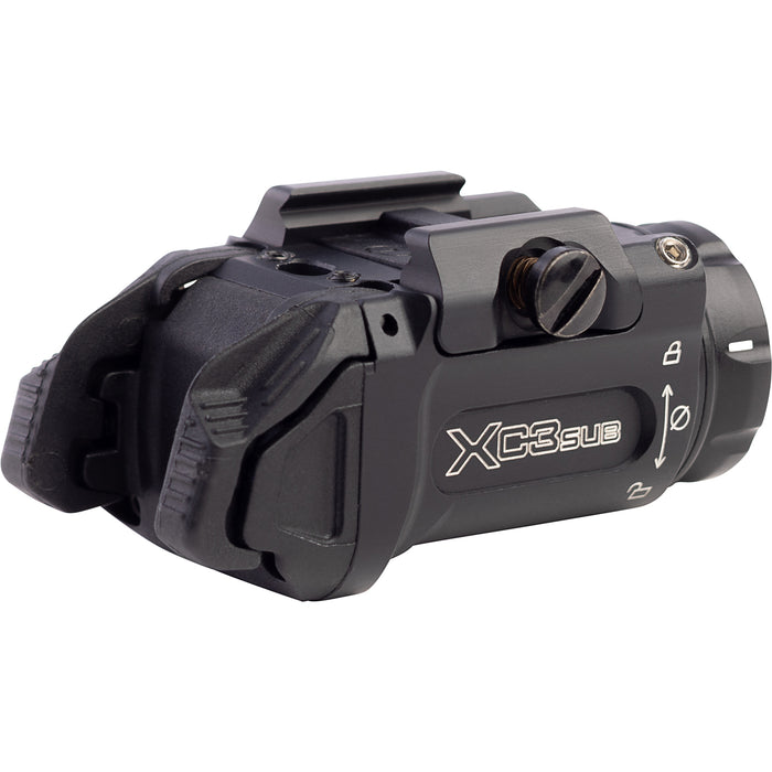 A rear isometric view from the left side of the XC3-SUB-A, showing the ergonomic placement of the ambidextrous toggle switches and the battery cap seal designed for quick access.